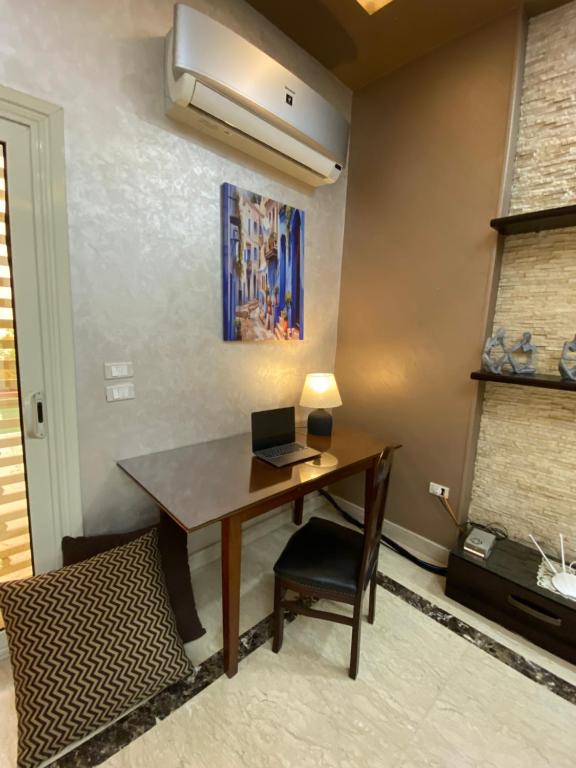 A television and/or entertainment centre at New Cairo 3BR Villa Garden & Prime Location By Best of Bedz