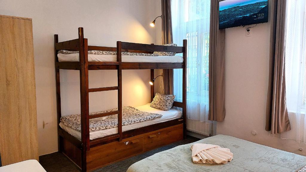 Postel nebo postele na pokoji v ubytování GoodMo Budapest Smart Rooms
