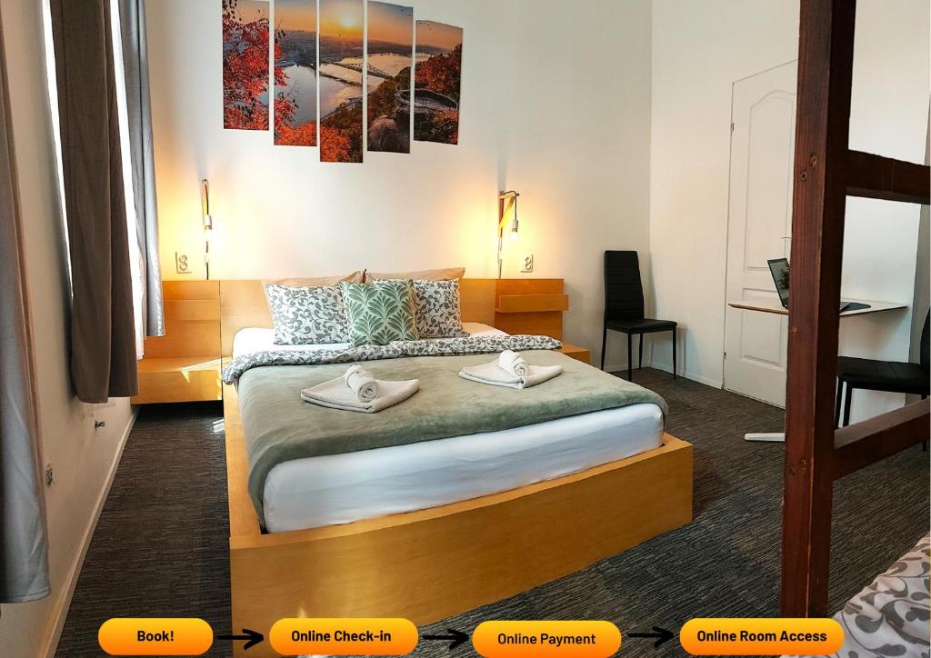 Postel nebo postele na pokoji v ubytování GoodMo Budapest Smart Rooms