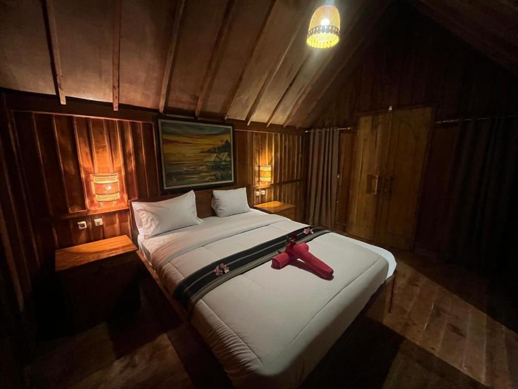 Postel nebo postele na pokoji v ubytování Dopi Rinjani Homestay