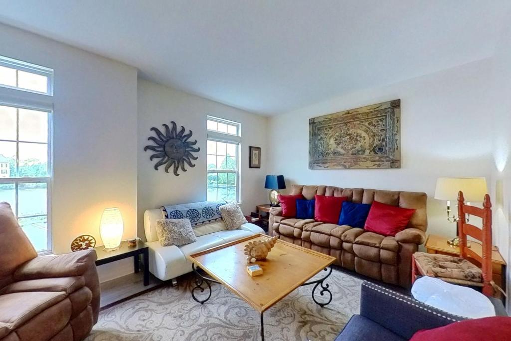 a living room with a couch and a table at Townhomes of Providence --- 9 John Hall Dr in Ocean View