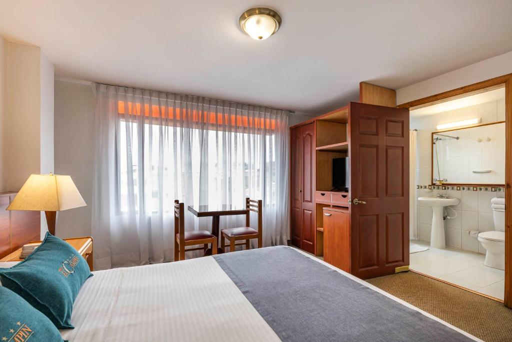 Postel nebo postele na pokoji v ubytování Hotel El Campin