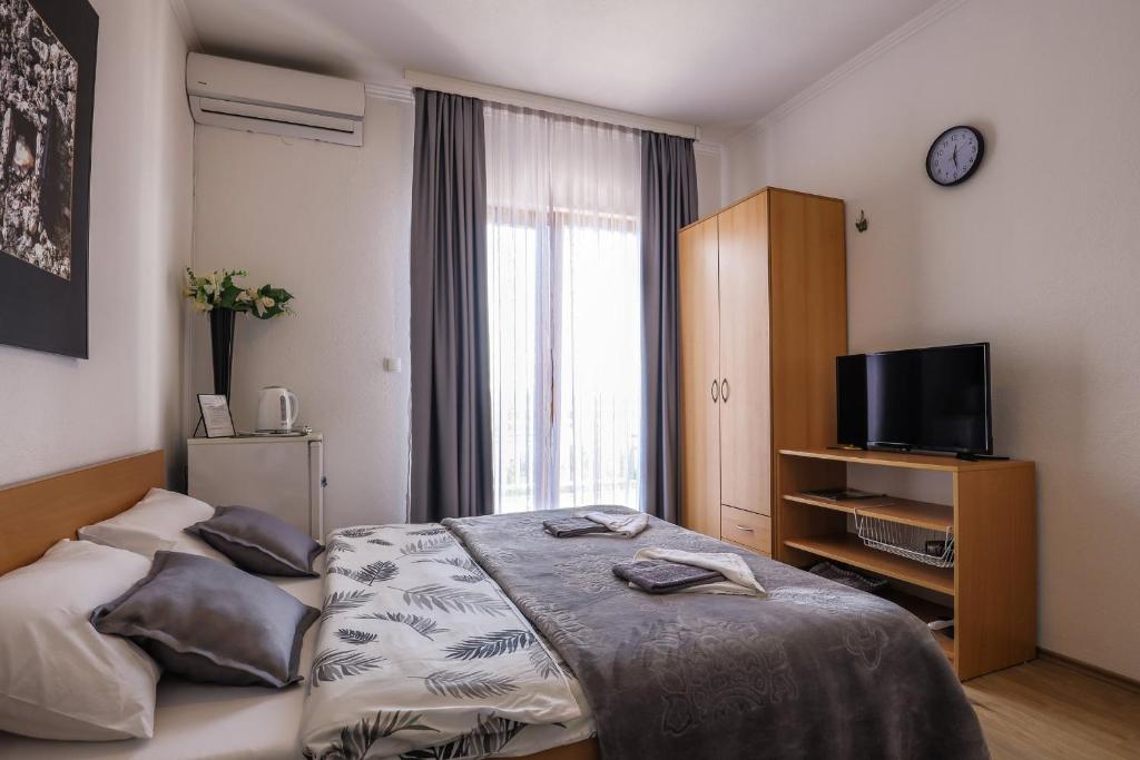 Postel nebo postele na pokoji v ubytování Rooms Bačić