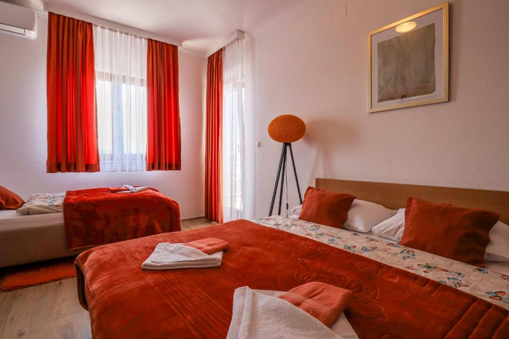 Postel nebo postele na pokoji v ubytování Rooms Bačić