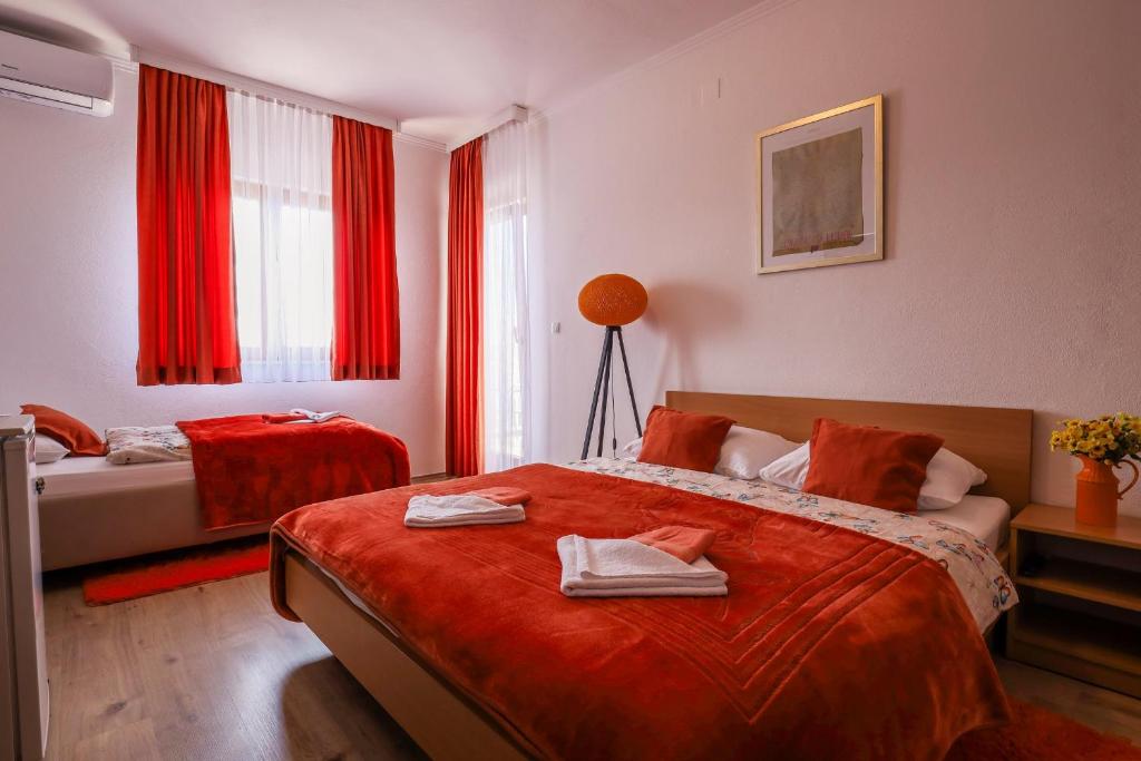 Postel nebo postele na pokoji v ubytování Rooms Bačić