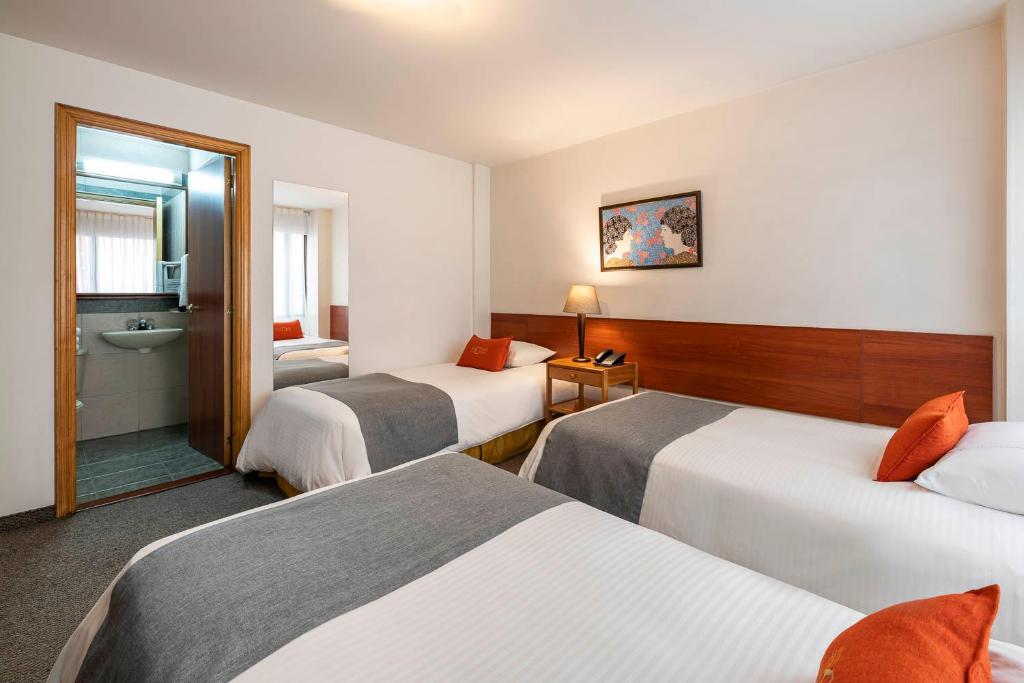 Postel nebo postele na pokoji v ubytování Hotel El Campin