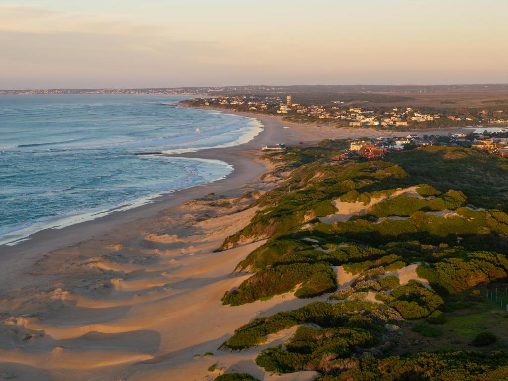 an aerial view of a beach and the ocean at Pelican Palms Aston Jeffreys Bay in Jeffreys Bay