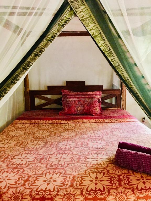Postel nebo postele na pokoji v ubytování Casa Umoja
