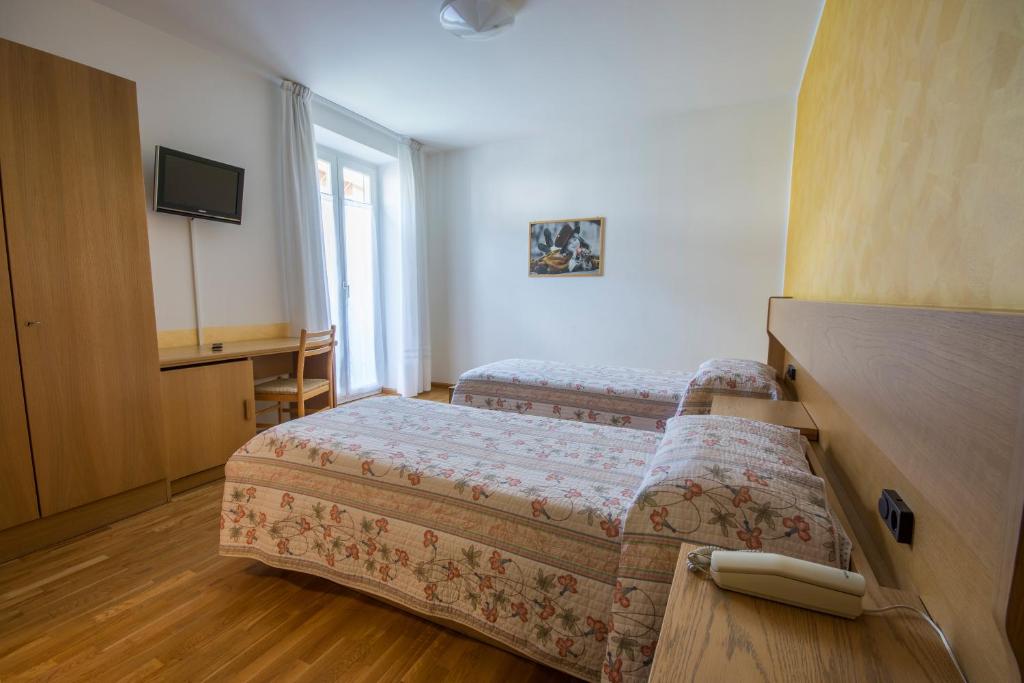 Postel nebo postele na pokoji v ubytování Garni Castel Ferari