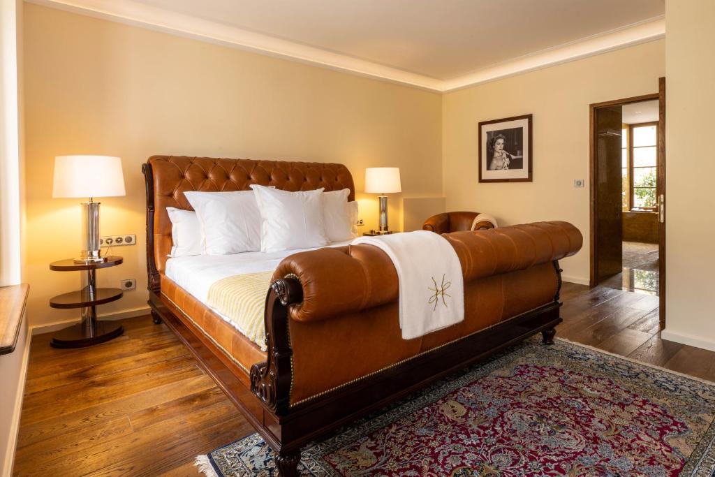 Postel nebo postele na pokoji v ubytování L'Hôtel