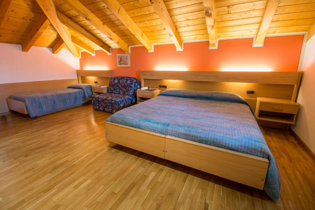 Postel nebo postele na pokoji v ubytování Garni Castel Ferari