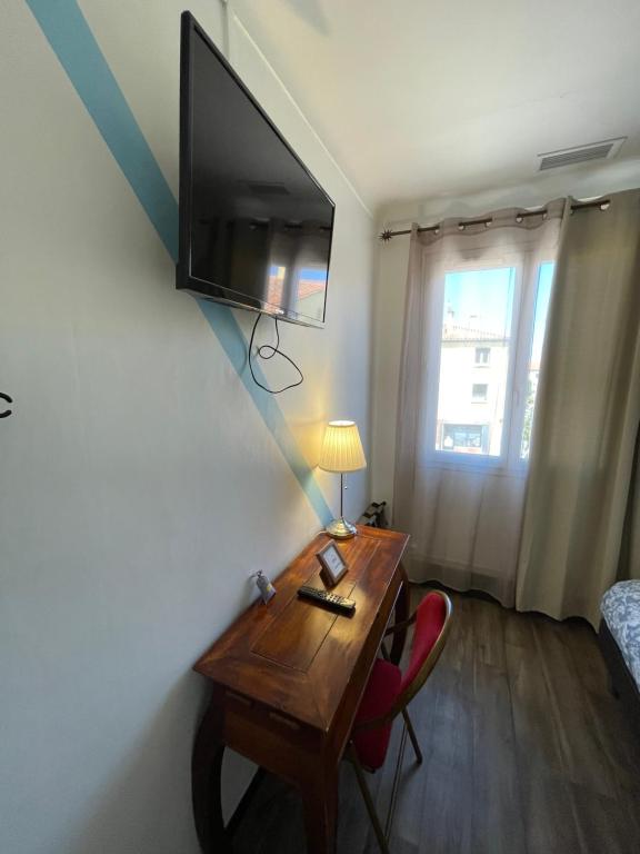 TV a/nebo společenská místnost v ubytování Hotel Clair Logis