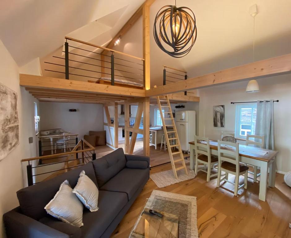 a living room with a couch and a loft at Ferienhaus Fachwerk Sanct Peter in Bad Neuenahr-Ahrweiler