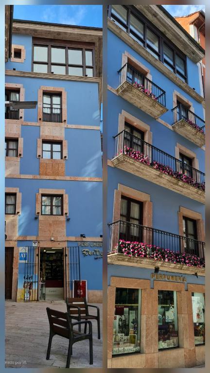 a building with a bench in front of it at Estudio Azul Paraíso in Llanes