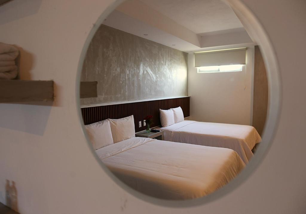 Postel nebo postele na pokoji v ubytování Hotel Urban 101