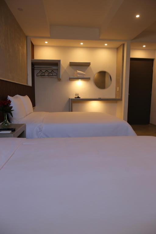 Postel nebo postele na pokoji v ubytování Hotel Urban 101