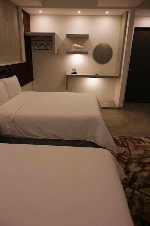 Postel nebo postele na pokoji v ubytování Hotel Urban 101