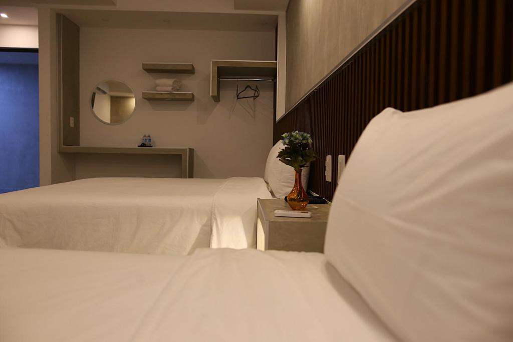 Postel nebo postele na pokoji v ubytování Hotel Urban 101