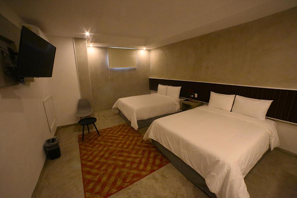 Postel nebo postele na pokoji v ubytování Hotel Urban 101