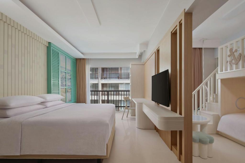 Postel nebo postele na pokoji v ubytování Four Points by Sheraton Bali, Kuta