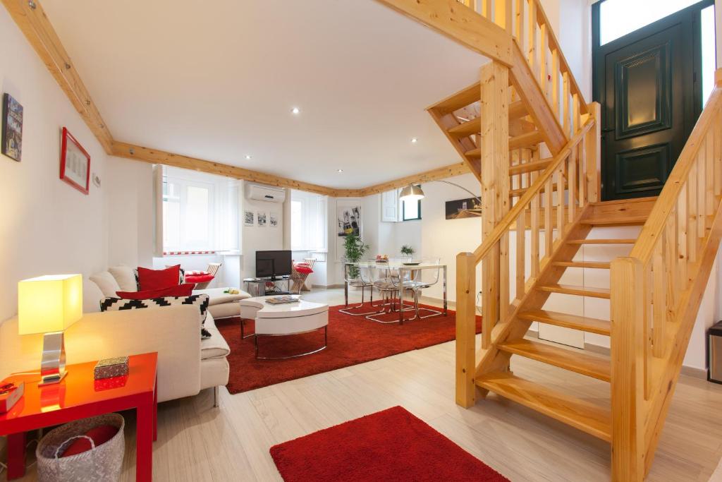 a living room with a staircase and a living room at Lisbon City Center Baixa in Lisbon