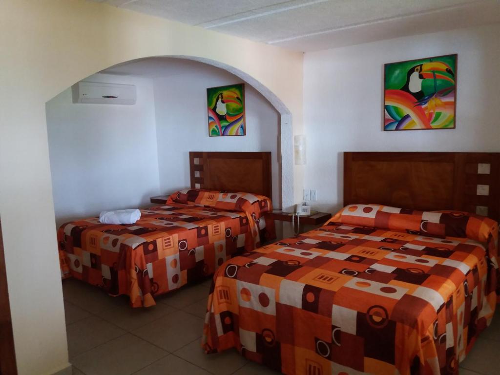 Postel nebo postele na pokoji v ubytování Hotel Torre Molino