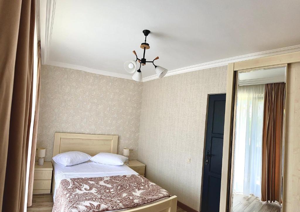Postel nebo postele na pokoji v ubytování Leto