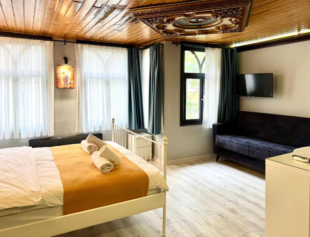 Postel nebo postele na pokoji v ubytování White Inn Taksim