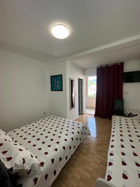 Postel nebo postele na pokoji v ubytování Apartmani Simona