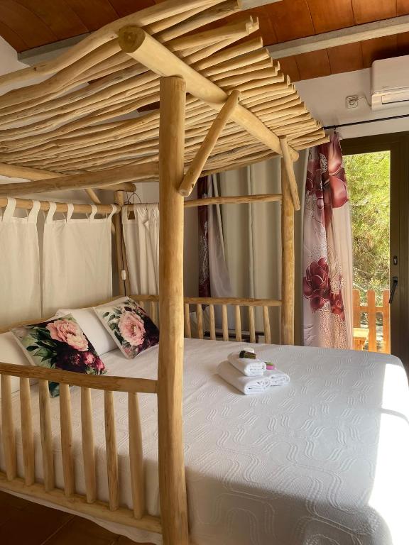 Postel nebo postele na pokoji v ubytování La Pérgola Habitaciones Rústicas