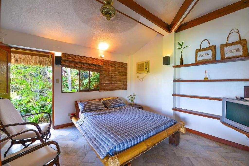 Voodi või voodid majutusasutuse Tropicana Ocean Villas toas