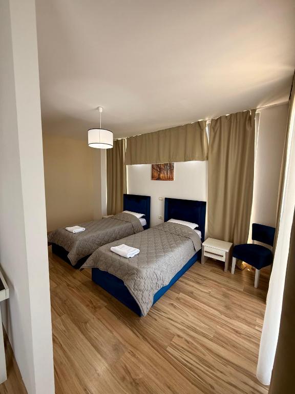 Postel nebo postele na pokoji v ubytování AMĀIA Hotel & Restaurant