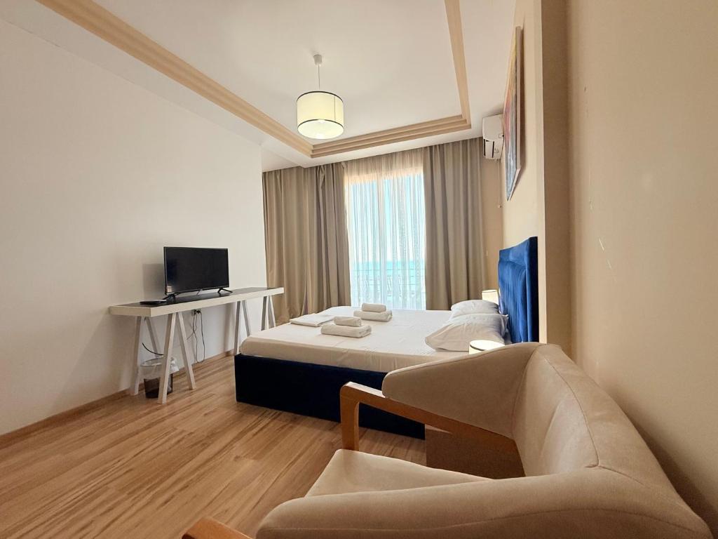 Postel nebo postele na pokoji v ubytování AMĀIA Hotel & Restaurant