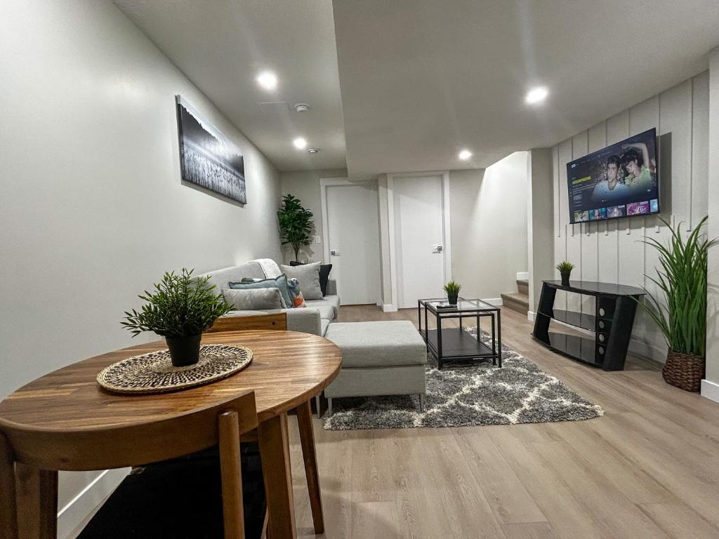 a living room with a table and a couch at Eli's Place in Calgary