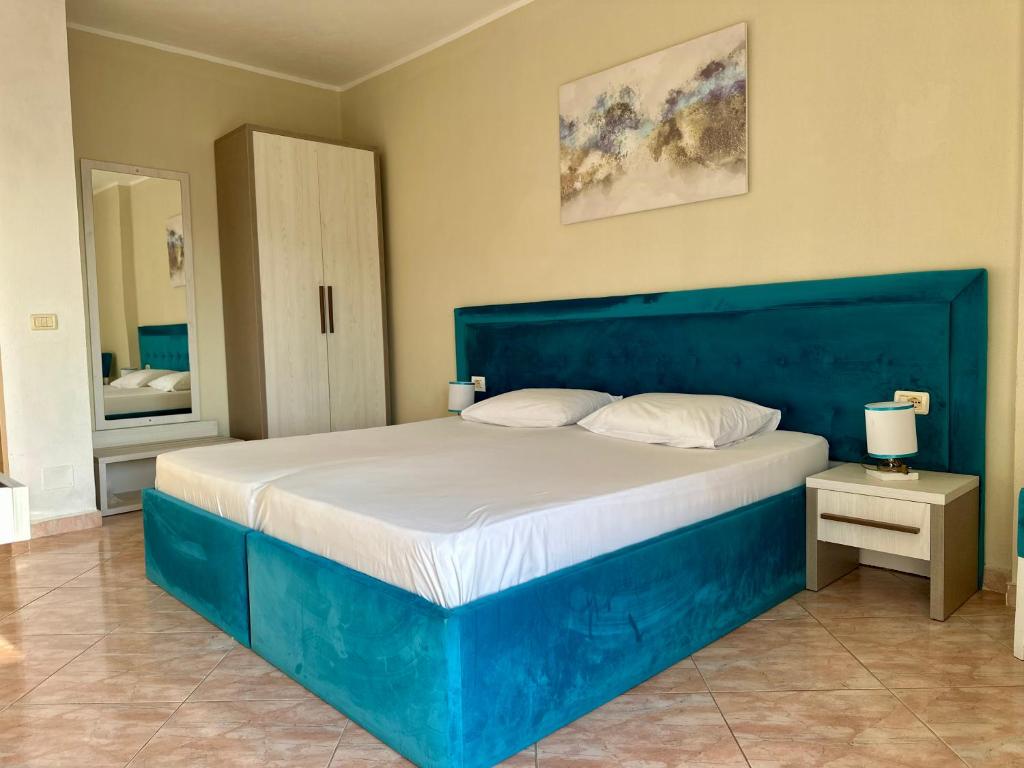 Postel nebo postele na pokoji v ubytování AMĀIA Hotel & Restaurant