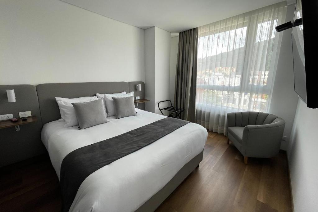 Postel nebo postele na pokoji v ubytování VOU Suites
