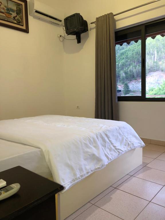 Postel nebo postele na pokoji v ubytování Hotel Xhej