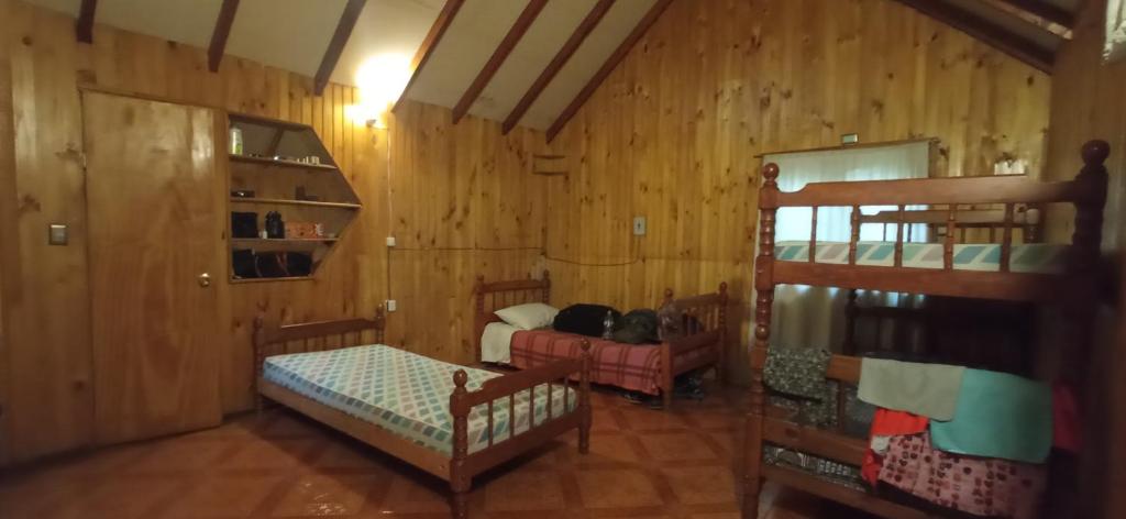 Cama o camas de una habitación en Cabañas Bosque las Trancas