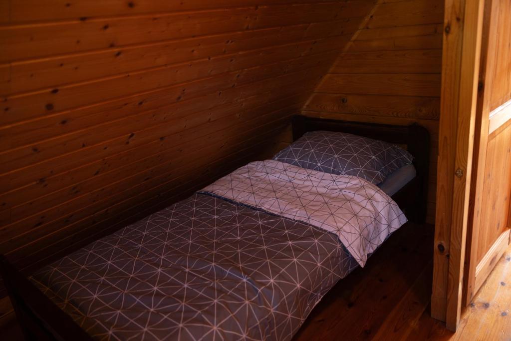 Postel nebo postele na pokoji v ubytování Domki OAZA