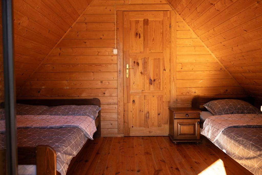Postel nebo postele na pokoji v ubytování Domki OAZA