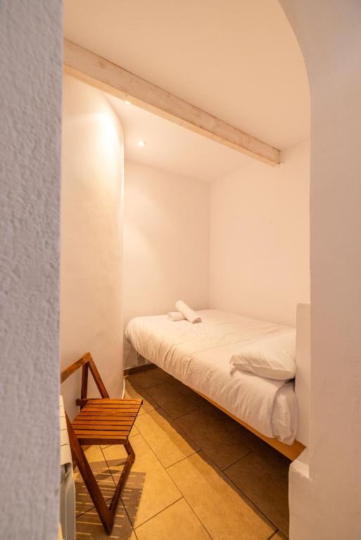 Postel nebo postele na pokoji v ubytování Alberg Taull