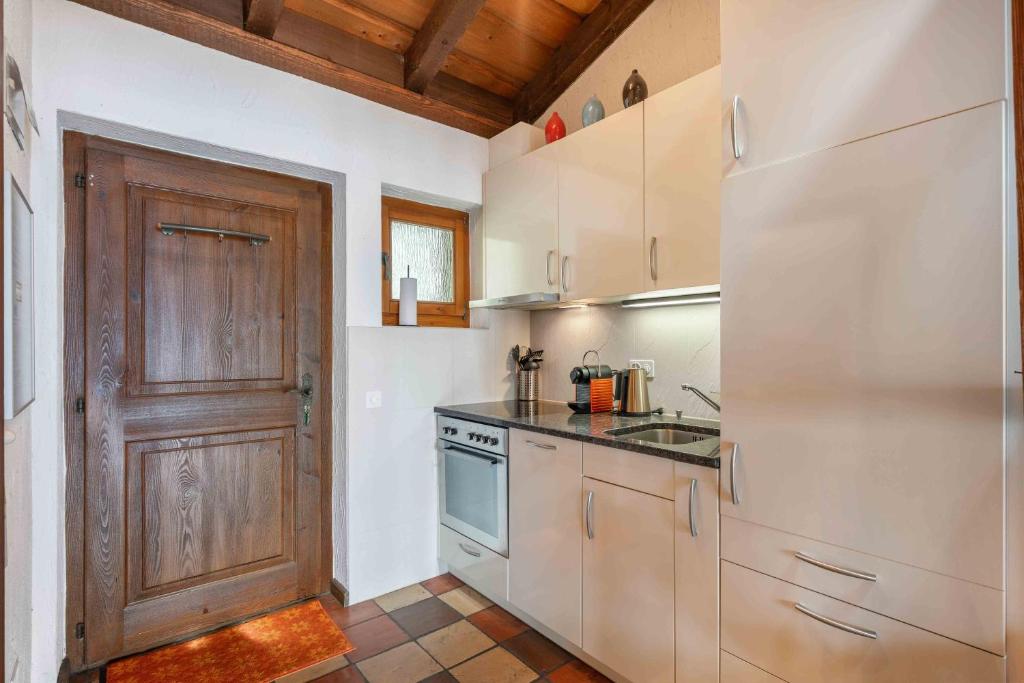 Kuchyň nebo kuchyňský kout v ubytování Residenza Paradiso App 1000