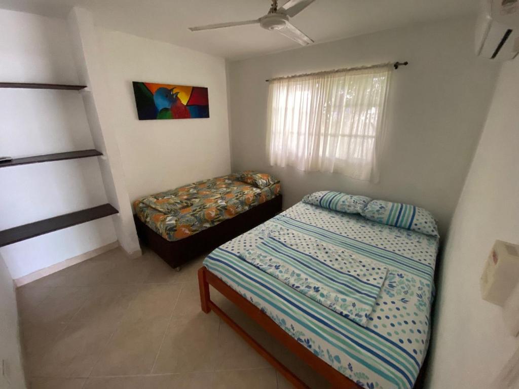 Postel nebo postele na pokoji v ubytování Casa de Playa Manecal