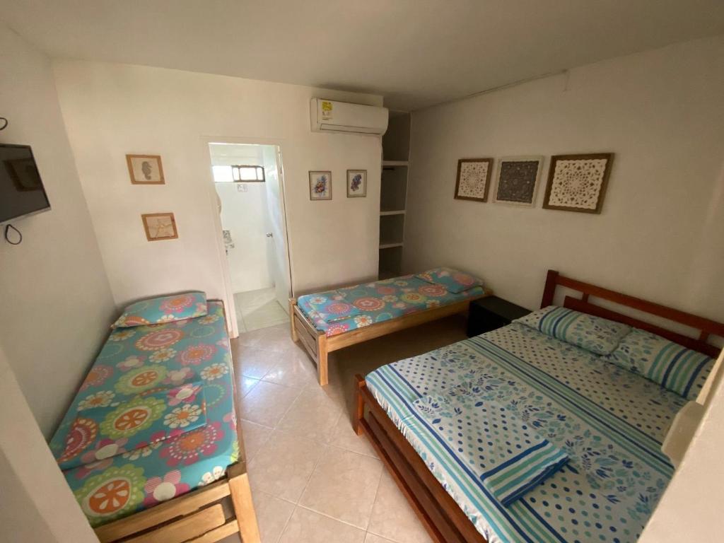 Postel nebo postele na pokoji v ubytování Casa de Playa Manecal
