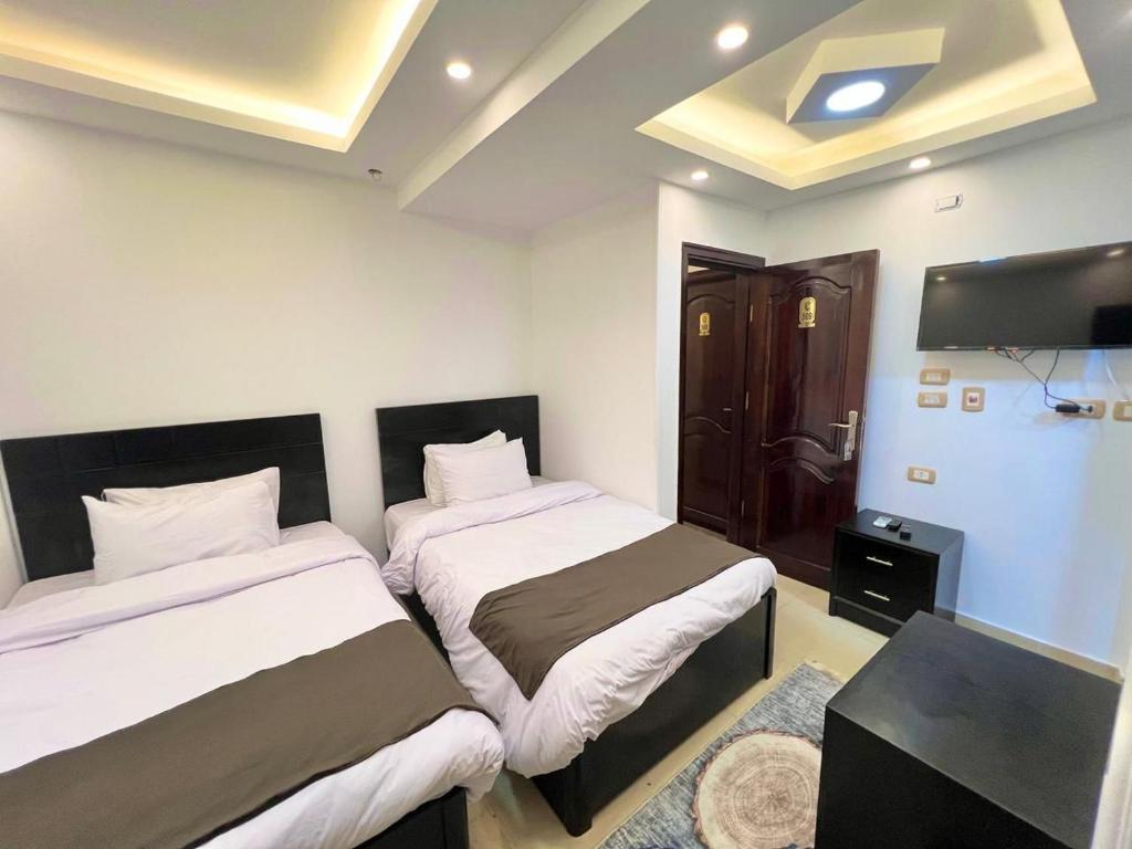 Postel nebo postele na pokoji v ubytování Memphis pyramids hotel