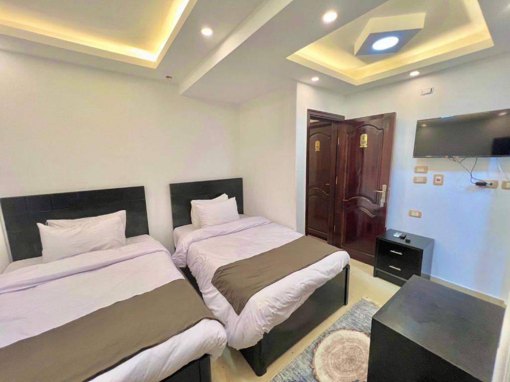 Postel nebo postele na pokoji v ubytování Memphis pyramids hotel