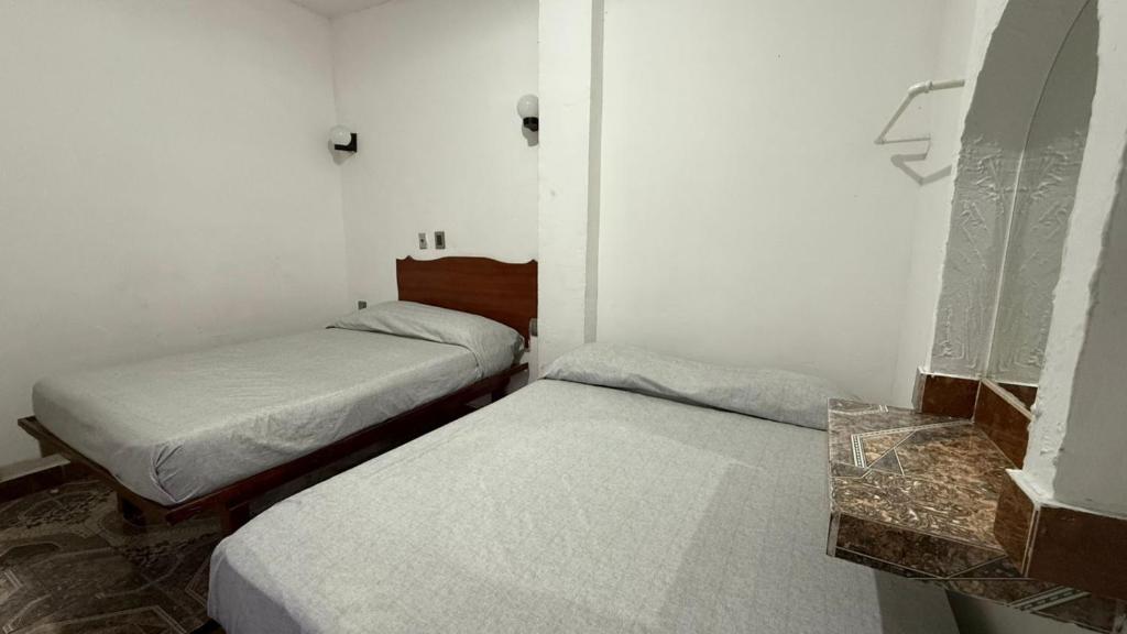 Postel nebo postele na pokoji v ubytování Hotel Climar