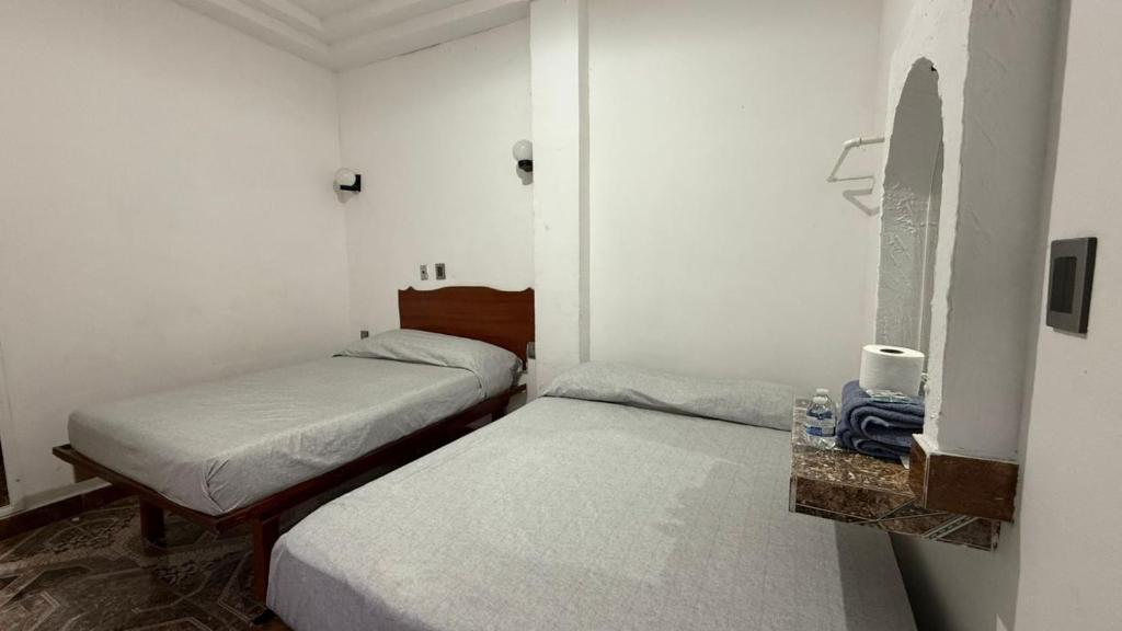 Postel nebo postele na pokoji v ubytování Hotel Climar