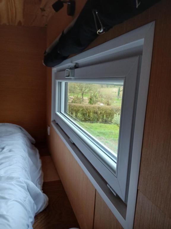 Postel nebo postele na pokoji v ubytování tiny house