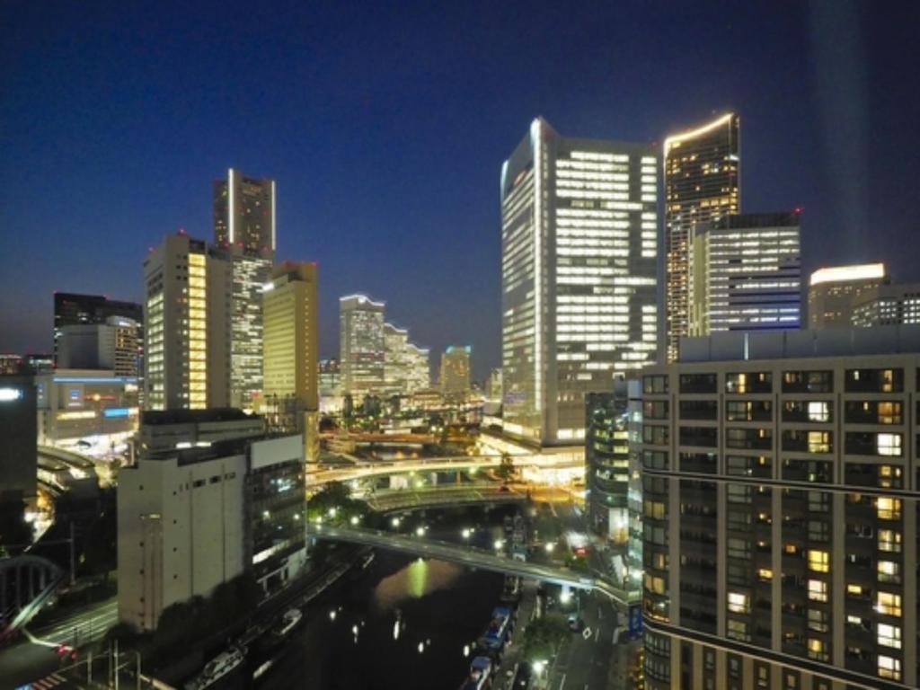 a view of a city at night with buildings at Far East Village Hotel Yokohama - Vacation STAY 27948v in Yokohama